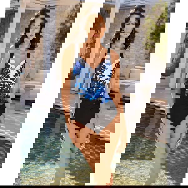 Stylish Miraclesuit Ombra Fiore Sanibel swimsuit in black/multi with bold blue floral pattern, moderate leg height, Lycra Xtra Life