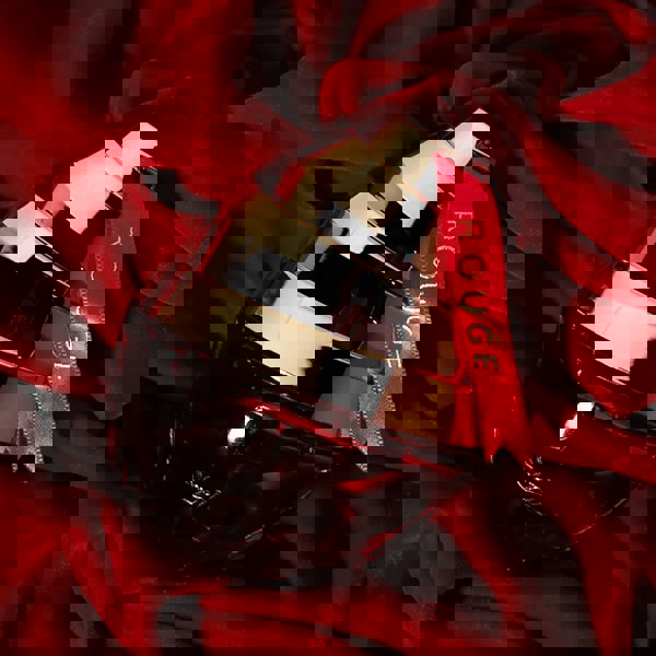 Sapil Rouge Eau de Parfum 100ml bottle on red satin fabric