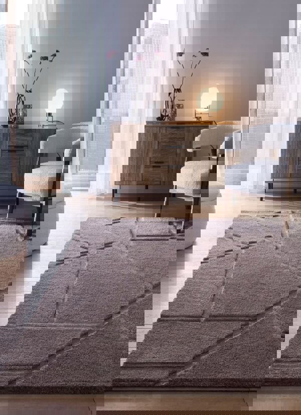 Scandinavian deep pile rug in cream and grey, adding warmth to a modern living room with minimalist decor.