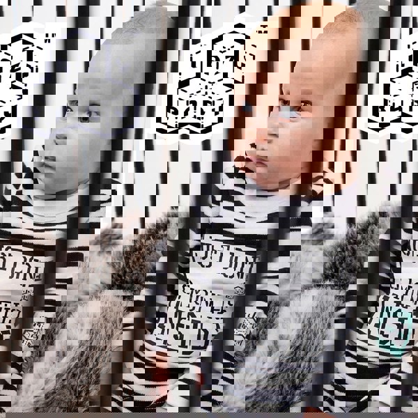 Baby wearing Just Done 9 Months Inside baby grow