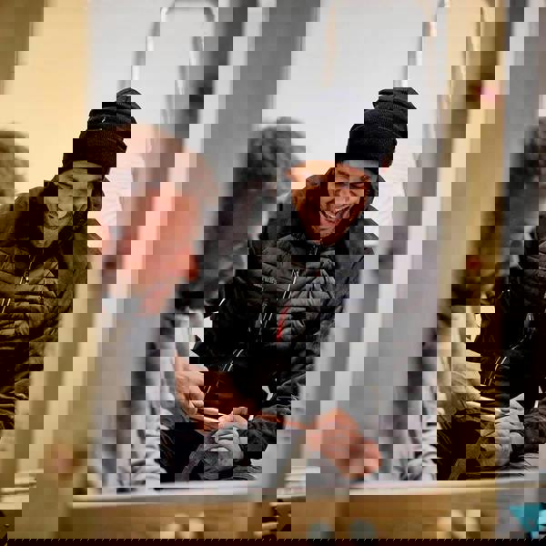 Scruffs Mens Trade Thermo Jacket Zip Up Work Warm Hooded Jacket Coat, two men working and sharing a laugh indoors, one wearing the jacket.