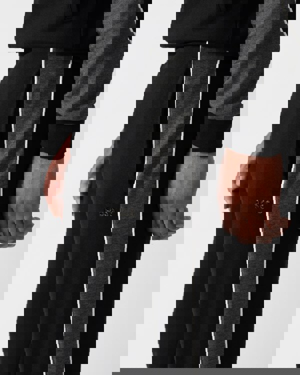 close up shot of a Model wearing a BOSS Orange Mens Loungewear Tracksuit Pants in Black