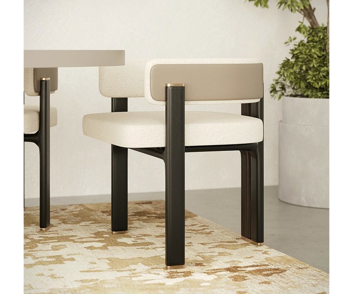 Karl dining chair with premium upholstery and refined brass details.