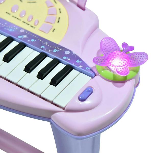 Pink mini electronic keyboard keys with flashing butterfly light on the right