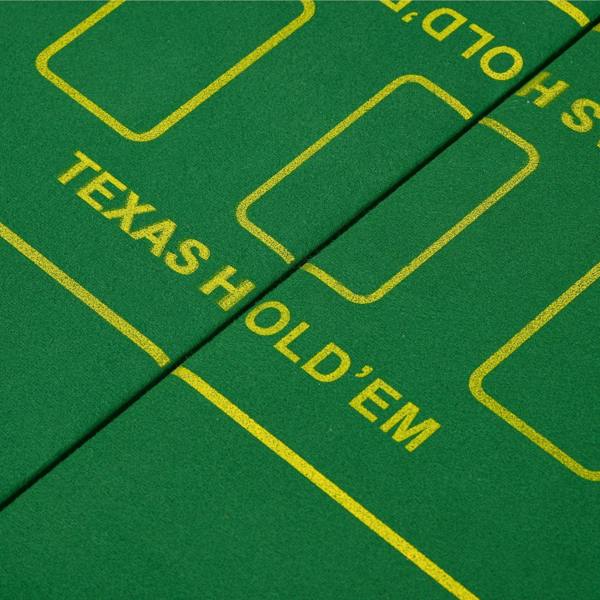 Close-up of green poker mat layout with yellow paths and Texas Hold'em text