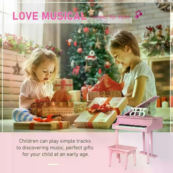 Pink mini kids piano with bench, used by children indoors