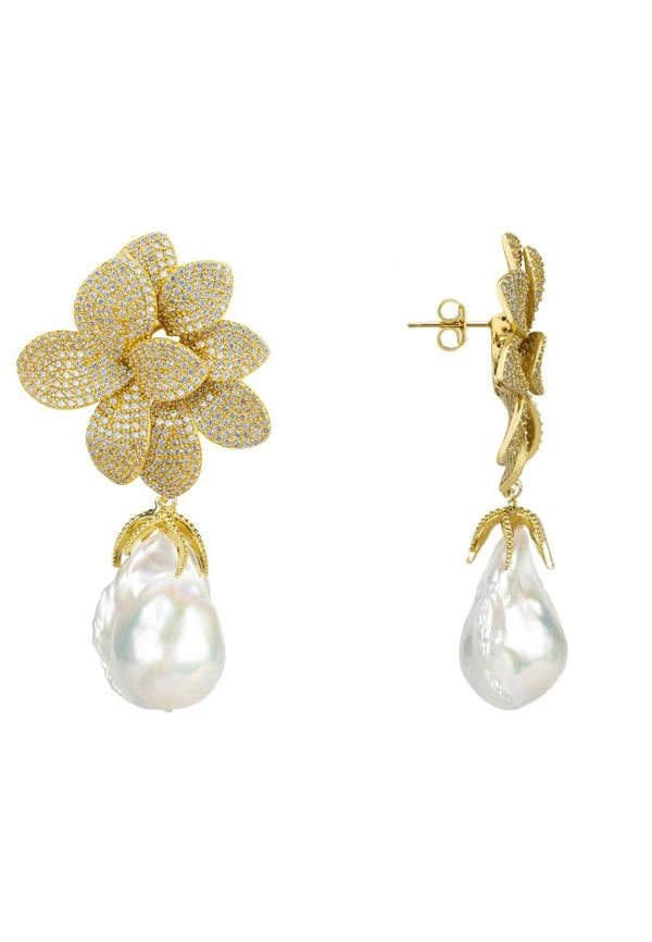 Gold flower-shaped earrings with pearl drops on a white background