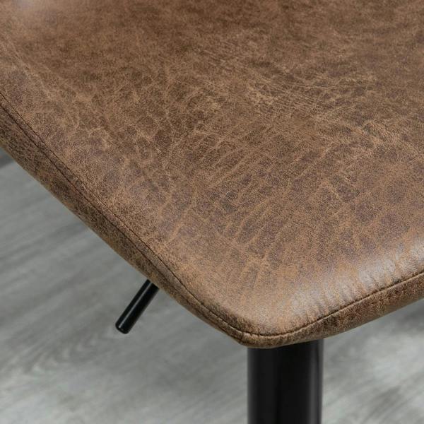 Close-up of brown cushioned seat edge with black support post and stitched trim.