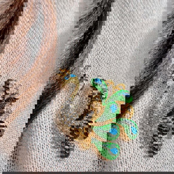 peacock brooch in enamel and crystal blue gold