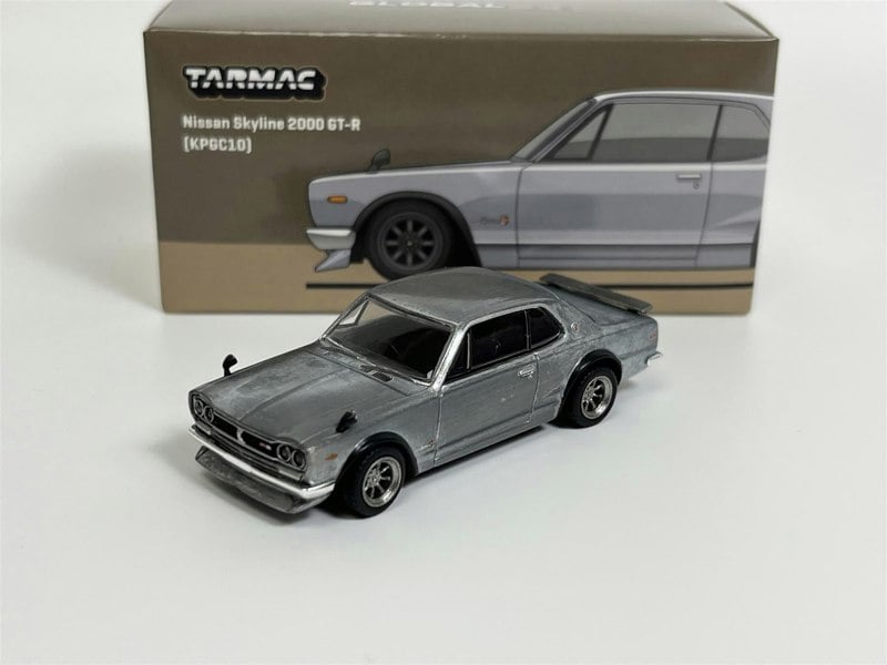 a toy car next to a box