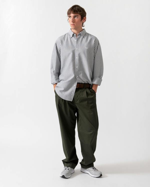 full length of model wearing a BOSS Orange Ricoplus Mens Long Sleeve Oxford Shirt in Dark Blue 404
