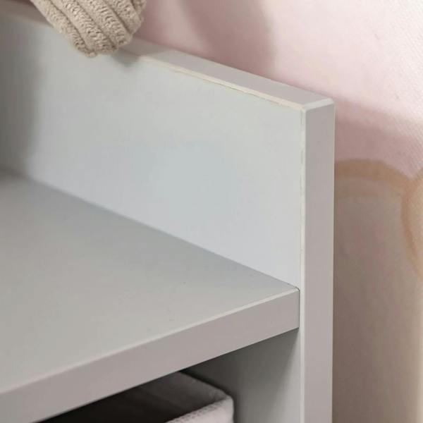 Grey bookcase shelf corner with white side panel and open cubby space