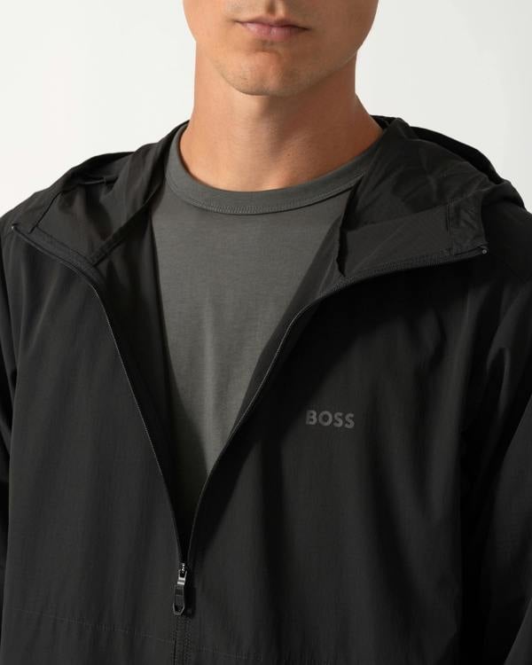 close up of model wearing a BOSS Green Airynix Mens Hooded Jacket in Black 001