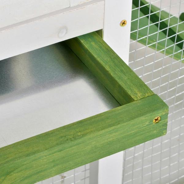 Green wooden ramp corner with metal screws on white frame and mesh