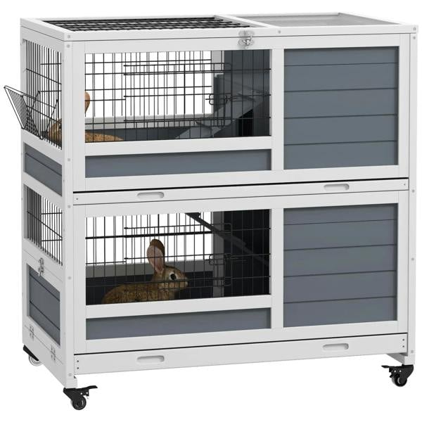 Grey double-decker small animal cage with wire front, divider panels, and ramp access
