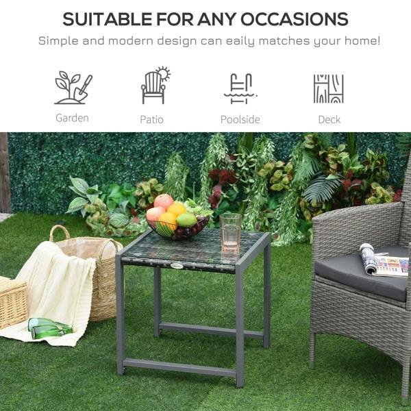 Grey rattan coffee table with dark glass top, square woven surface for outdoor seating