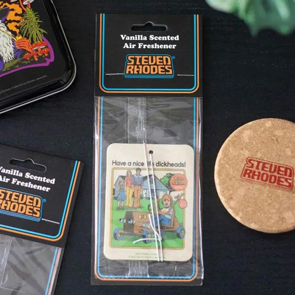 Vanilla scented air freshener card in retail package with Stewed Rhodes branding and scent disc