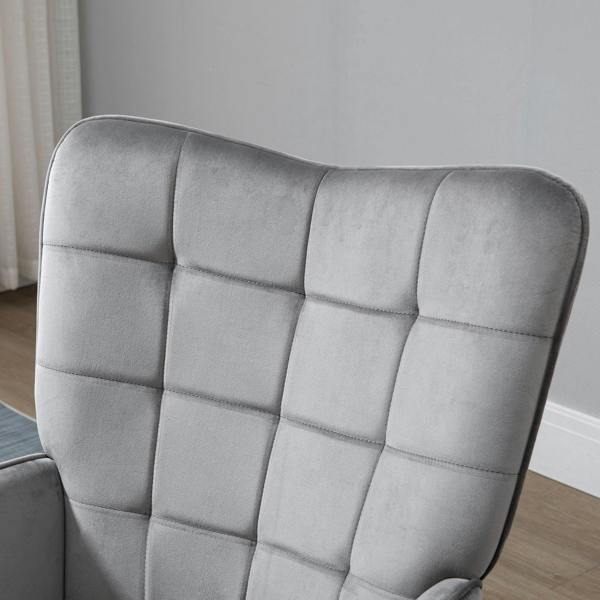 Grey tufted wingback chair backrest with diamond stitching detail