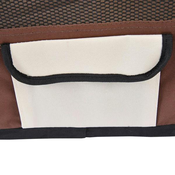 Portable pet playpen side storage pocket on brown and white fabric with black trim.