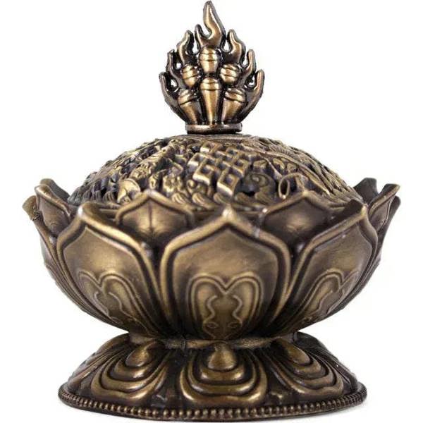 Brass-toned metal lotus incense cone holder with flame finial and engraved base
