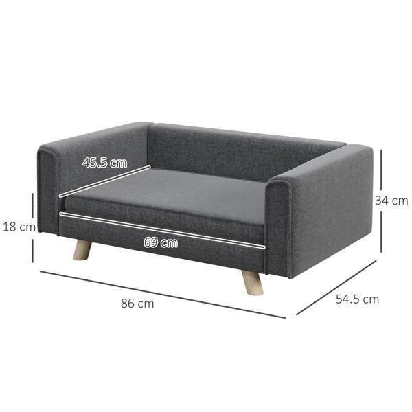 Grey dog sofa bed with cushion and armrests, wooden legs, angled product view