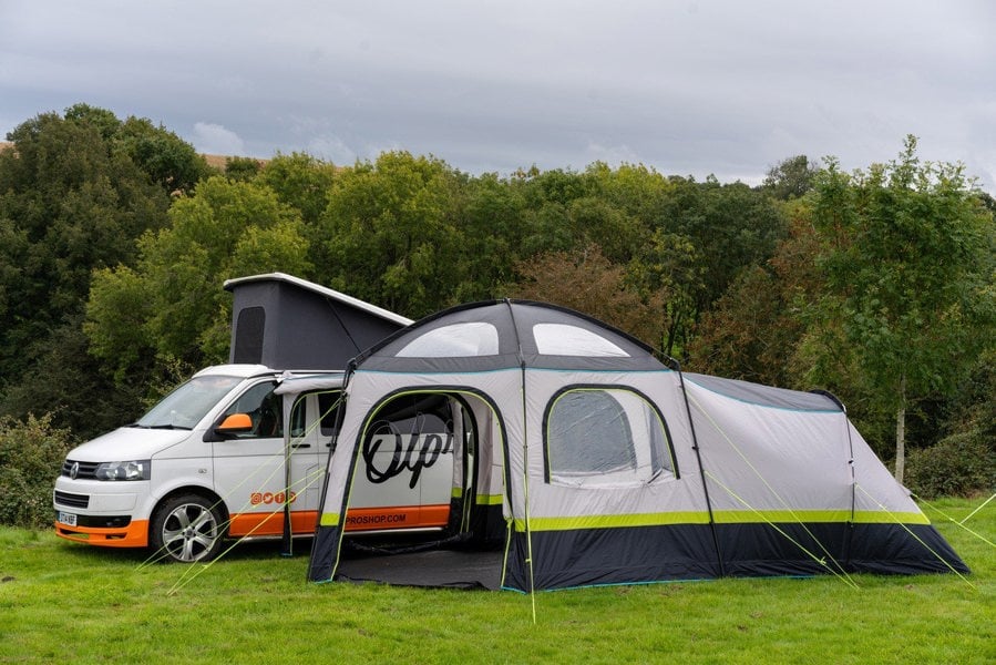 Hive Poled Campervan Awning in a busy campsite attached to a Volkswagen T5