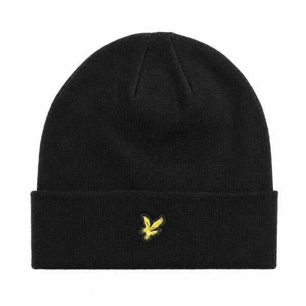 Lyle & Scott jet black merino wool beanie with a folded cuff and signature yellow eagle logo patch.