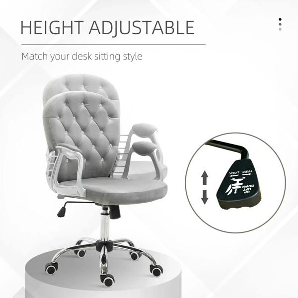 Grey velvet office chair with height-adjustable mechanism and padded armrests