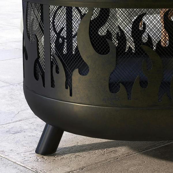 Close-up of flame-pattern cutouts on black fire pit body with three supporting legs