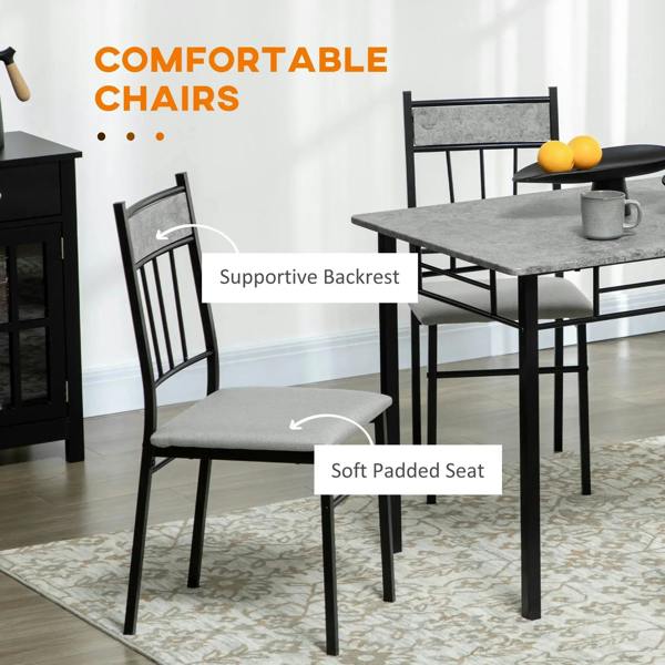 Grey marble-effect dining table with dark chairs and padded seats
