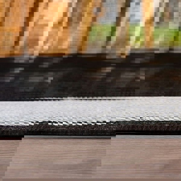 Outdoor Black Bordered Rug Weather resistant, Durable.