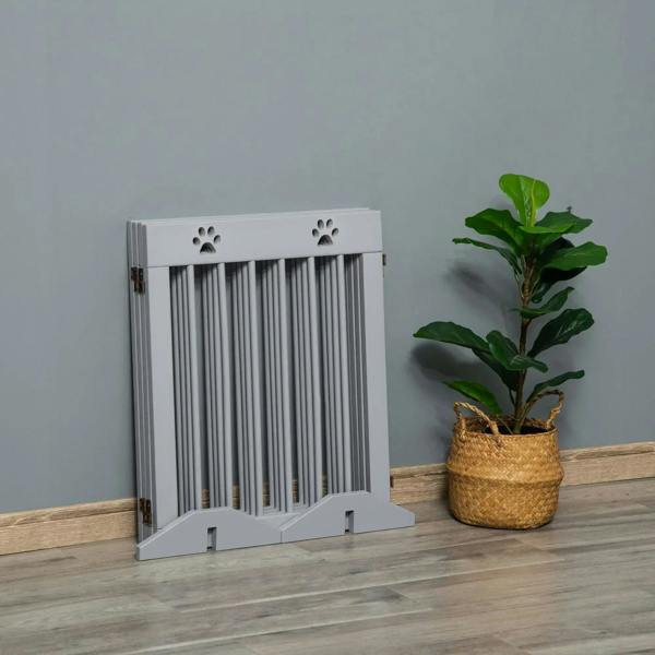 Grey folding wooden pet gate with vertical bars, paw print accents, and two front support feet