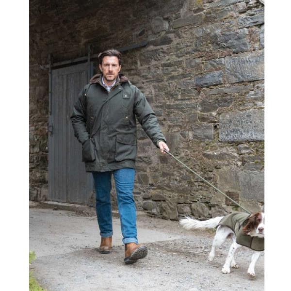 Man walking the dog wearing the Hoggs of Fife Kelso wax jacket