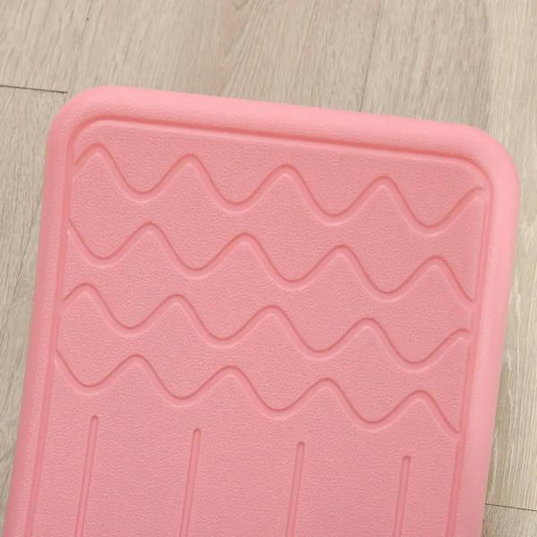 Pink balance board textured non-slip surface with raised zigzag pattern