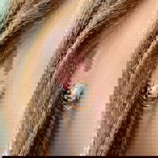 Pearl clip-on earrings, large round faux pearl centrepiece, irregular gold-tone open frame, modern vintage inspired jewellery, elegant statement accessory
