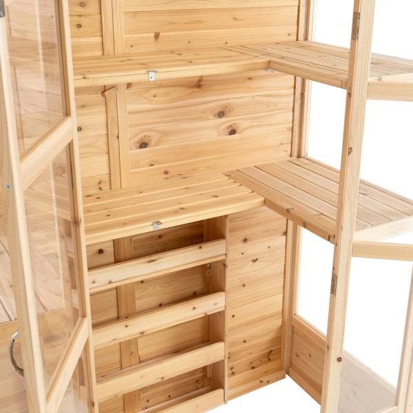 Natural wood shelves and storage drawers inside a Victorian greenhouse, showcasing a warm, rustic finish and spacious design
