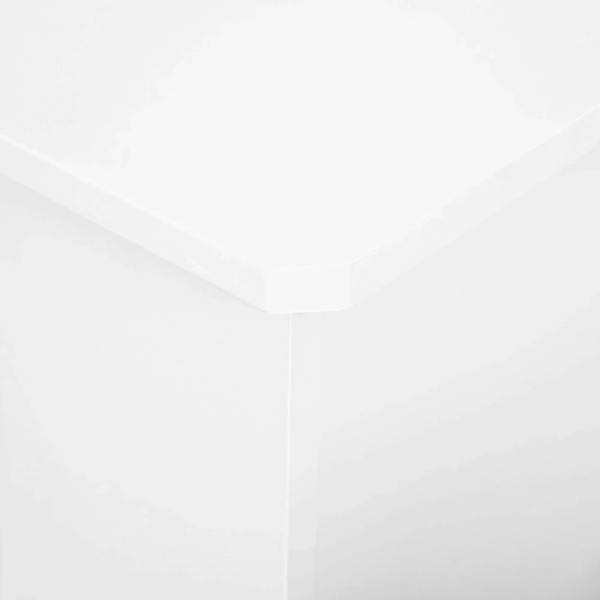 White radiator cover corner close-up with smooth top edge and side support.