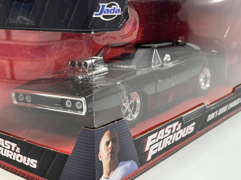 a black toy car in a box