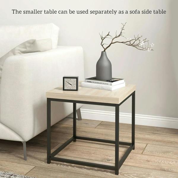 Small nest side table with oak-look top and black frame beside a sofa