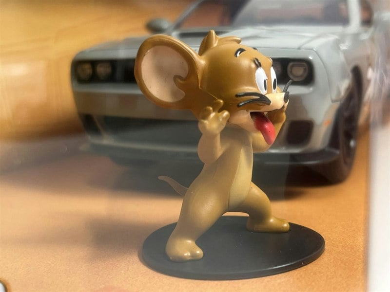 a toy mouse standing on a table