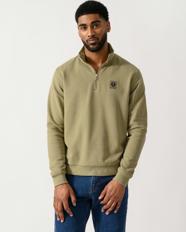 Model wearing a Belstaff Quarter Zip Sweatshirt in Fatigue Green