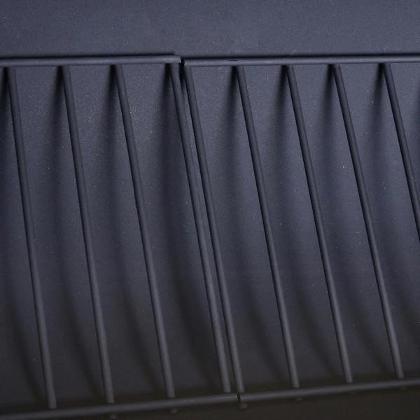 Black steel grill firebox side panel with vertical ridged texture.
