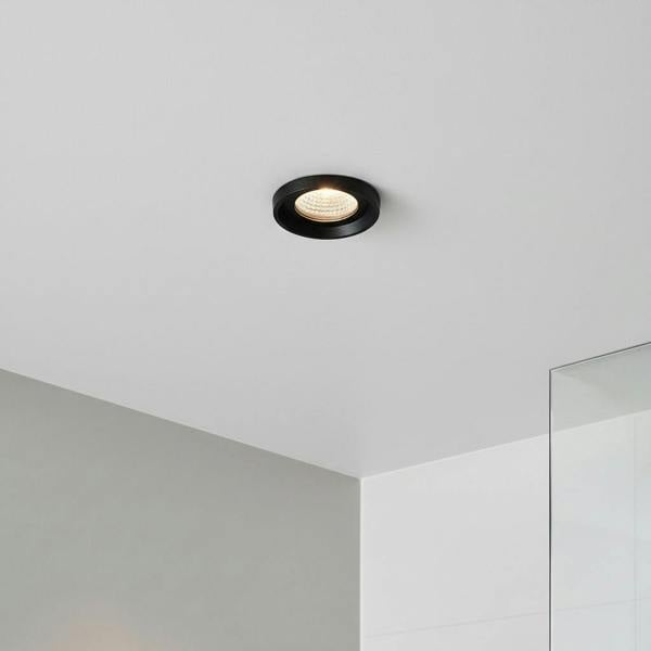 black bathroom ceiling spotlight in a modern shower room 