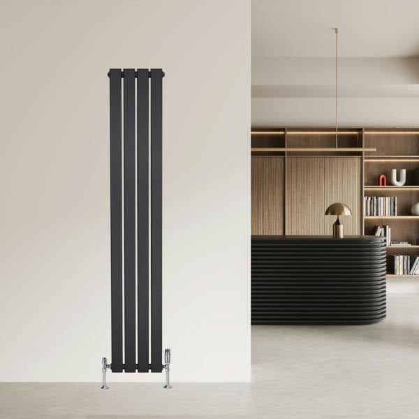 Flat single column radiator in anthracite grey, featuring a sleek vertical design with four slim panels, mounted on a light wall