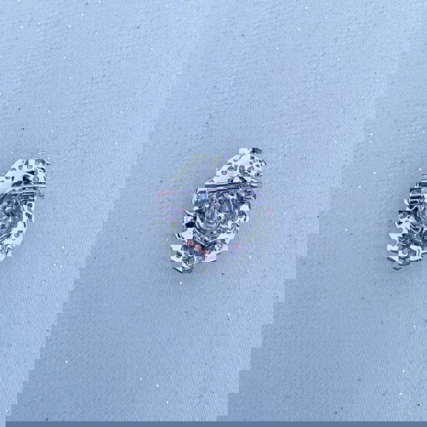 Silver brooch, small round design, polished metal finish, detailed cut-out pattern, classic pin fastening, versatile decorative accessory
