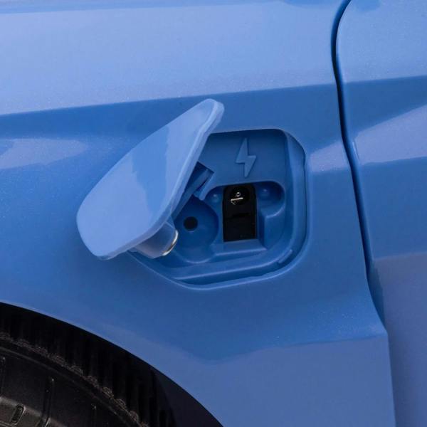 Blue electric ride-on car side port compartment with cover opened