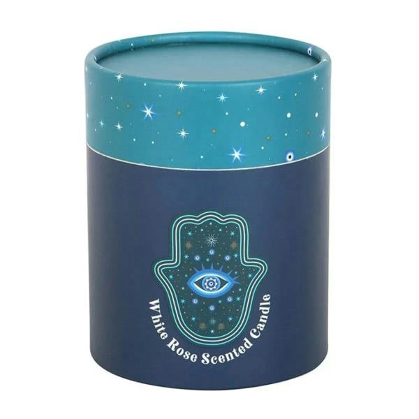 Blue candle jar with teal star pattern and centered teal hamsa eye emblem