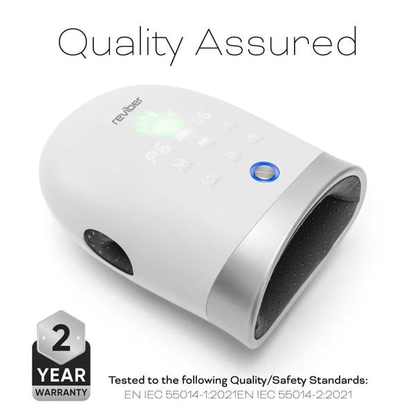 White Reviber Hand Spa Massager with Heat & Finger Stretch, featuring a digital display and labeled Quality Assured. Designed for deep tissue massage with adjustable speed, it displays a 2-year warranty badge and notes compliance with international quality and safety standards at the bottom.