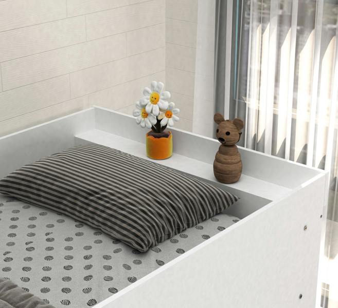 striped pillow, flower, and teddy bear in a room with white walls and a window.