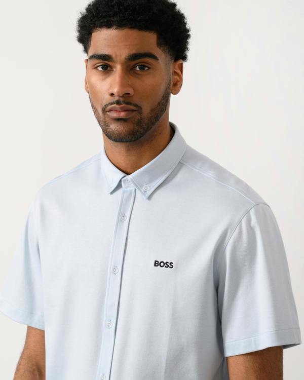close up shot of a model wearing a BOSS Green ST_Motion Mens Short Sleeve Shirt in Open Blue 460